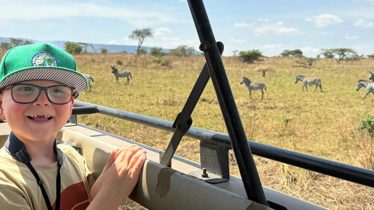Lions resting on a Serengeti plain on a two-day Serengeti safari package from Zanzibar, Tanzania