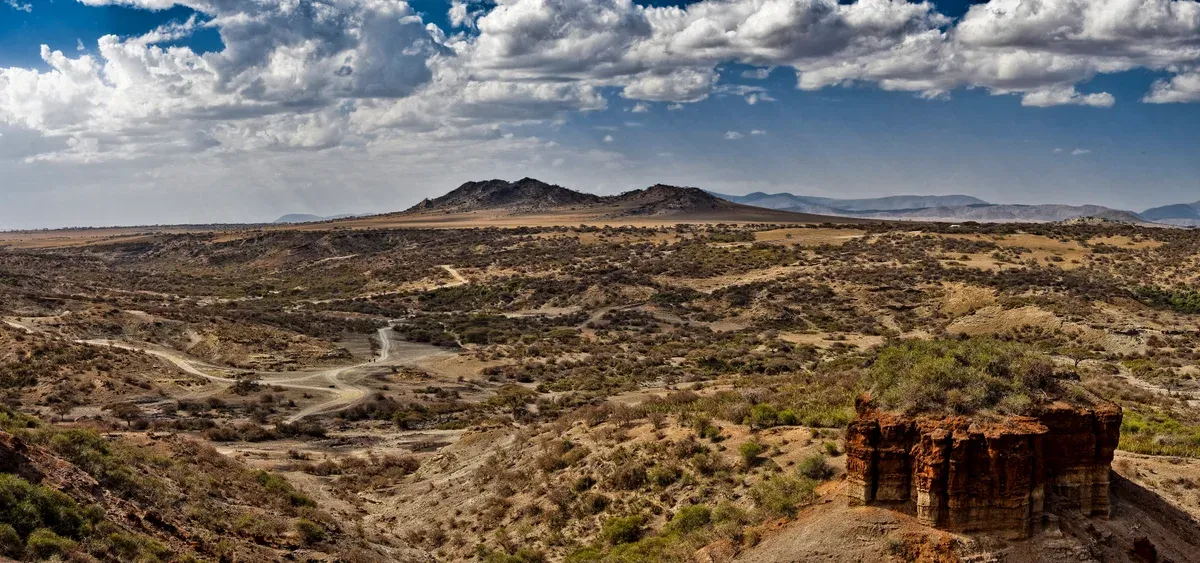 The dry gorge landscape at Olduvai Gorge in Tanzania, visited on Serengeti safari packages between the crater and the Serengeti